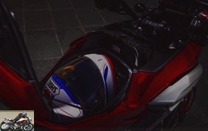 The false tank can accommodate a full face helmet
