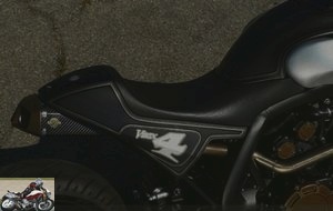 The VMAX is adorned with a single saddle typical of Cafe Racers